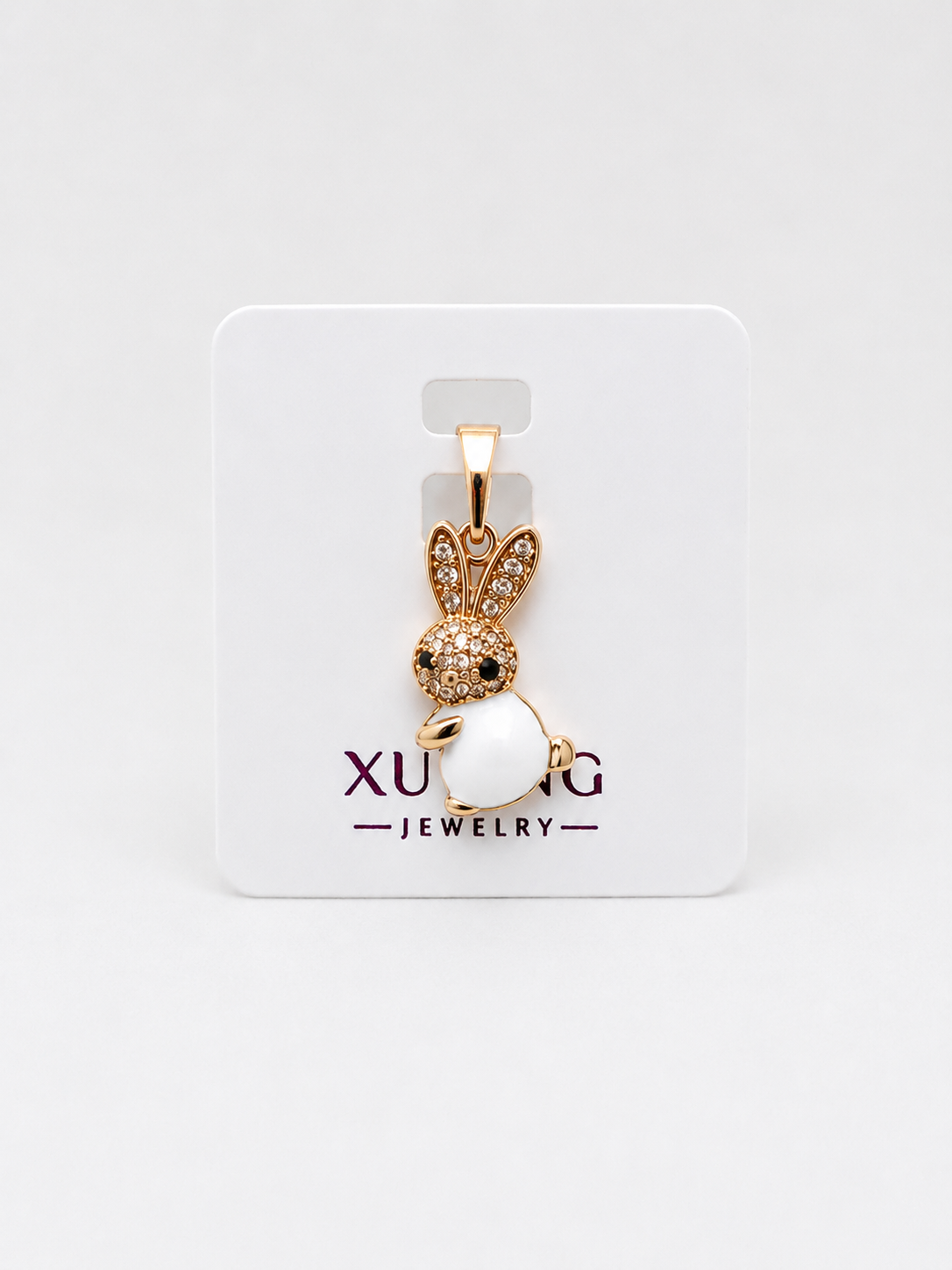 DIJE CONEJITO BLANCO DOBLE ENCHAPE 18K DORADO