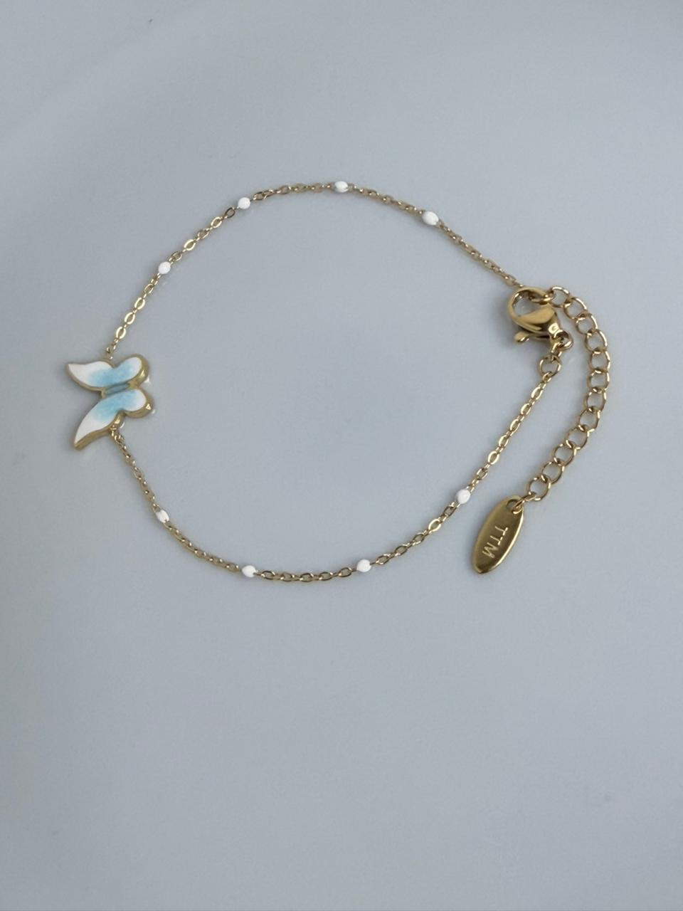 PULSERA DE ACERO  CON MARIPOSA CELESTE