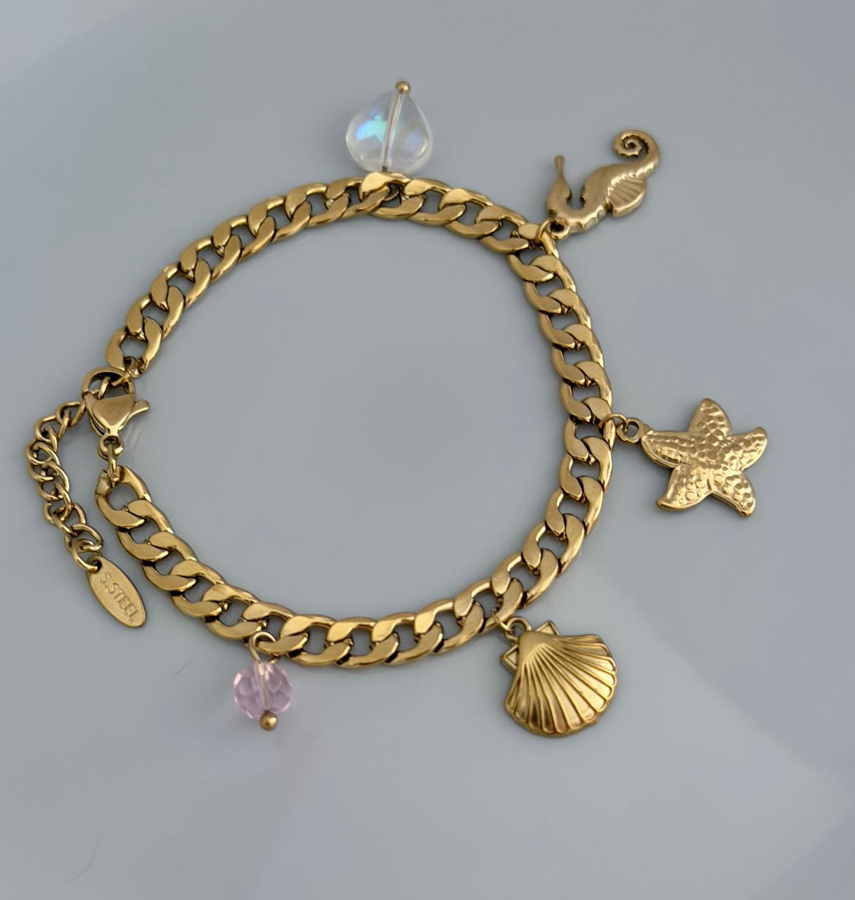 PULSERA CON DETALLE ESTRELLA  Y CABALLITO MAR DOBLE ENCHAPE 14K