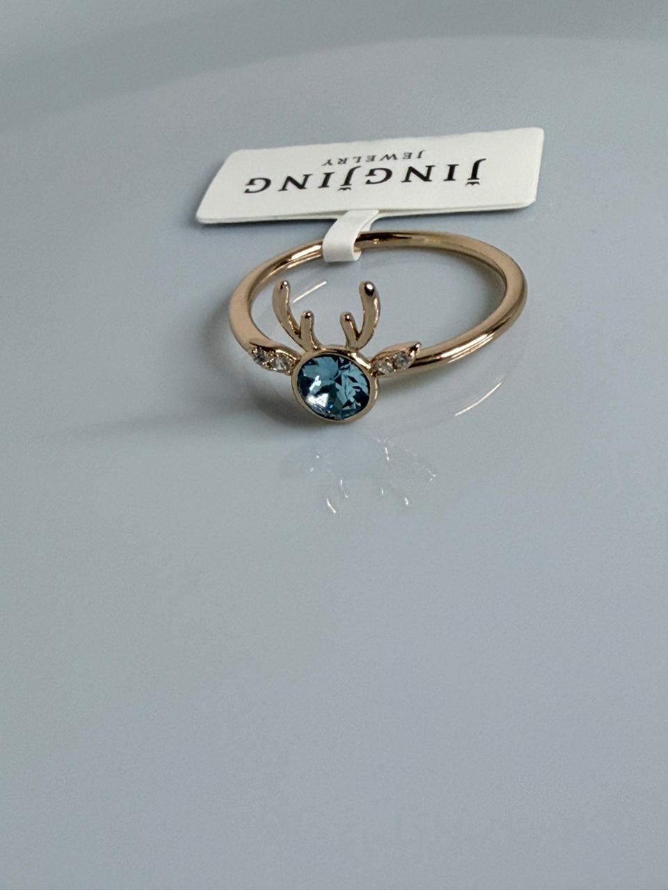 ANILLO DE RENO CON CRITAL CELESTE  DOBLE ENCHAPE 18K (TALLA 7)